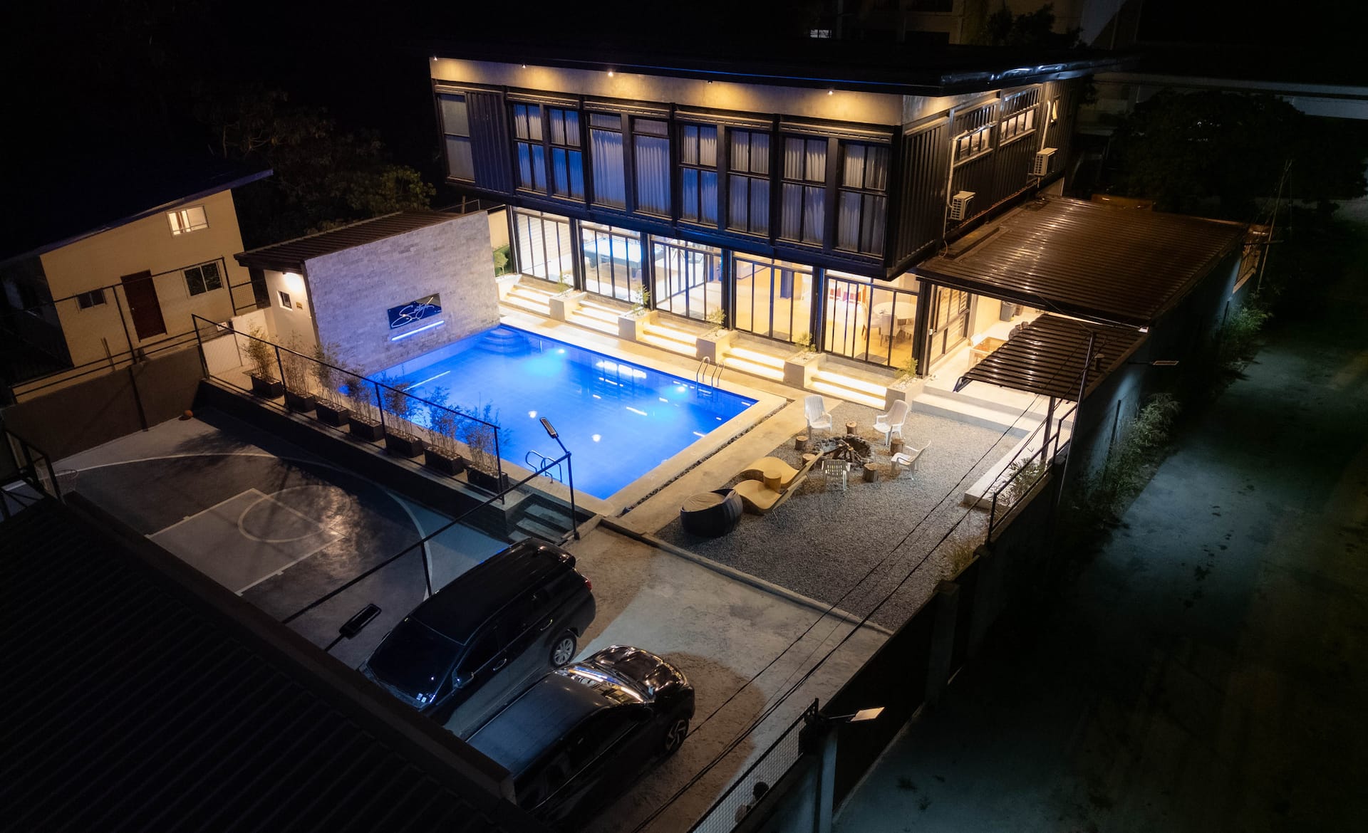 Elevated night view of the illuminated Santiagos Resort compound